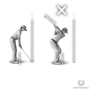 The club points left of the target in a laid-off position